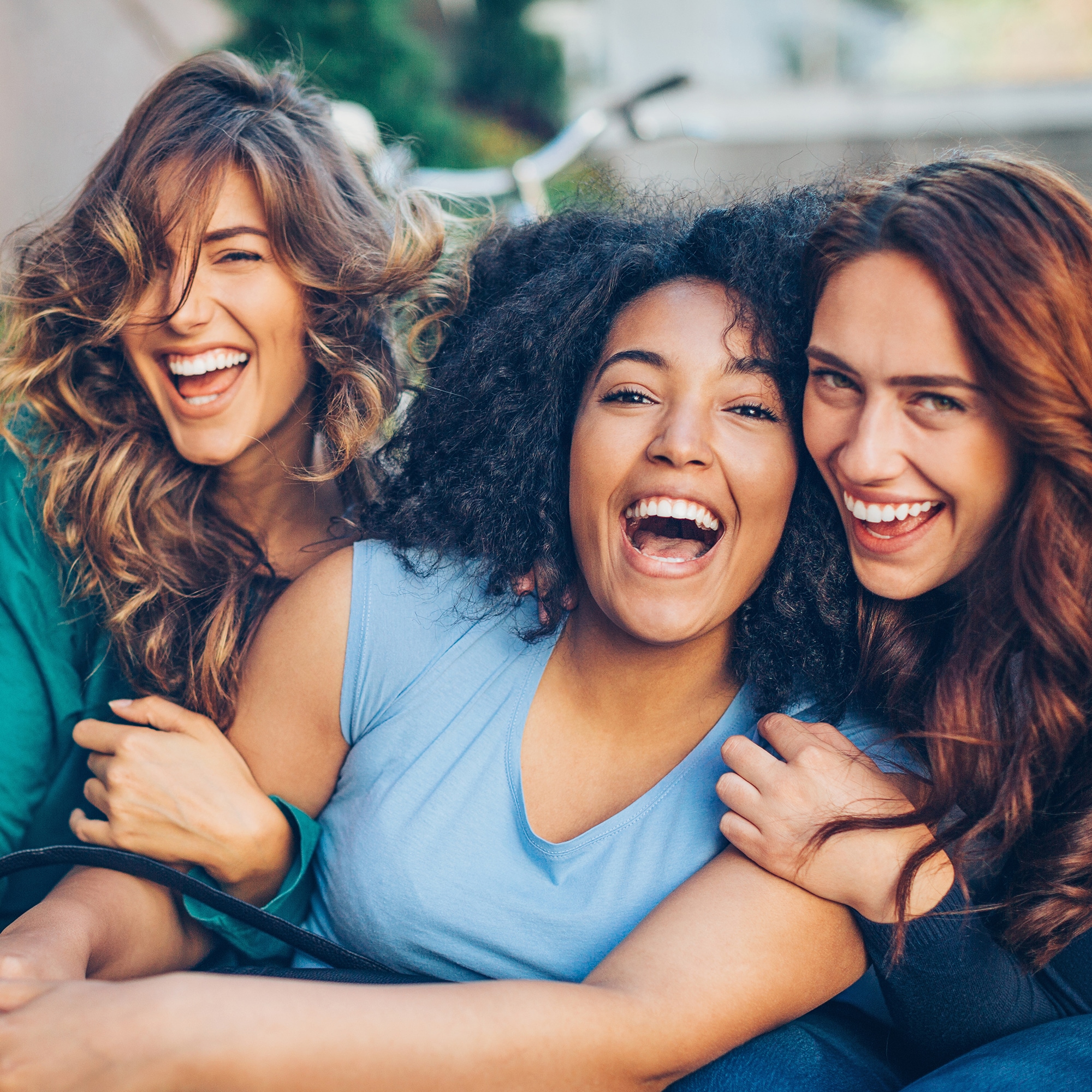 Three women smiling